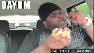 Video gif. Excited man holding a burger raises a fist in the air and says, “Dayum, Dayum, Dayum!”