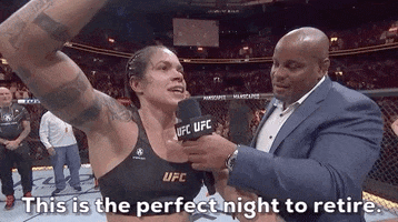 Sports gif. UFC fighter Amanda Nunes is being interviewed after a fight as she pumps a fist above her head and says, "This is the perfect night to retire."
