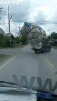 Overloaded Pickup Truck Loses Cargo