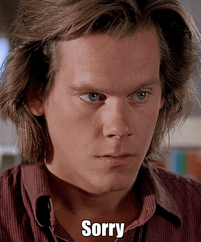 Movie gif. Kevin Bacon as Valentine in Tremors. He looks apologetic as he drinks his cheeks and mouth upwards, saying, "Sorry."