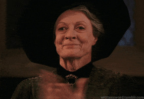 Movie gif. Maggie Smith as Professor McGonagall applauds with tears in her eyes, proud.