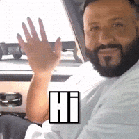 Celebrity gif. We are seated in a car next to DJ Khaled as he smiles at us and waves. Text, "Hi."