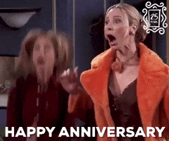 Friends gif. Jennifer Aniston as Rachel and Lisa Kudrow as Phoebe clap wildly while jumping up and down excitedly. Text, "Happy Anniversary."