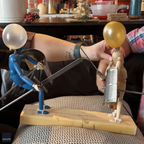 Man Creates Rock 'Em Sock 'Em Robots with Balloons for Heads 
