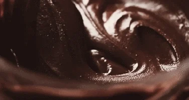 GIF of chocolate icing being stirred