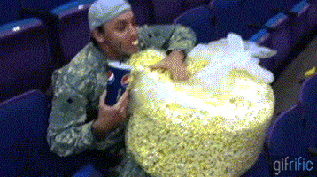 eating popcorn GIF