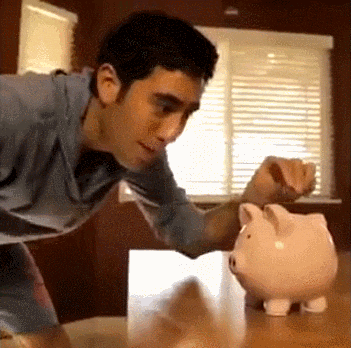Celebrity gif. Zach King drops a coin into the slot of a piggy bank, which then rears backward and appears to poop out a slice of bacon.
