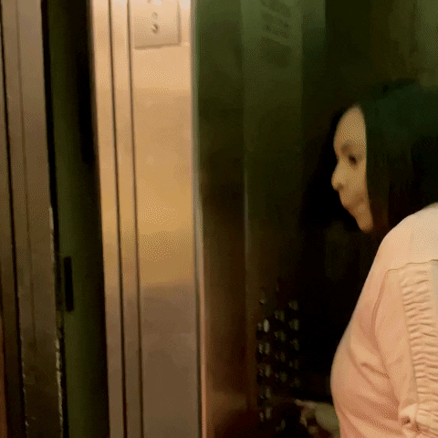 ComedianHollyLogan coronavirus social distancing elevator introvert GIF