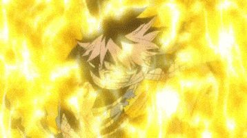 Anime gif. Natsu from Fairy Tail grins deviously while engulfed in a yellow flaming hellscape.