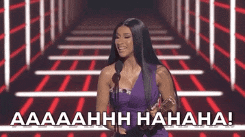 Celebrity gif. Cardi B holds an award and screams into a microphone at the Billboard Music Awards. Text, "Aaaaahhhh, Hahaha!