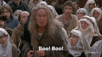 Movie gif. Margery Mason as The Ancient Booer from The Princess Bride, living up to her name as she yells at us angrily. Text, "Boo! Boo!"
