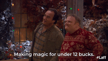 TV gif. Actor Jim Belushi in LIfe According to Jim admires his Christmas decor with his neighbor and contentedly says "Making magic for under 12 bucks!"