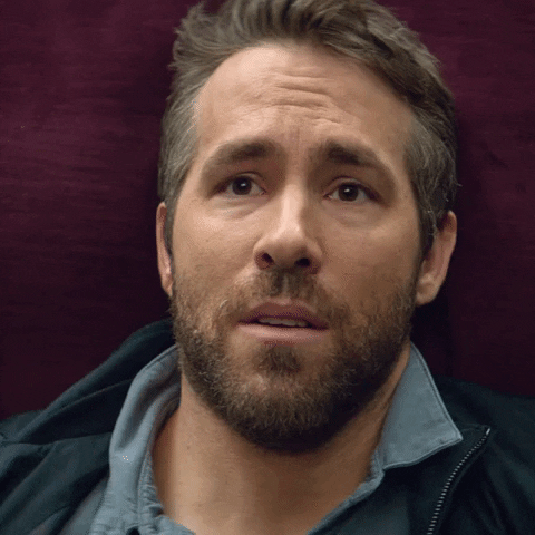 Movie gif. Actor Ryan Reynolds as Michael Bryce in The Hitman's Wife's Bodyguard stares despondent as we zoom in on his hopeless expression.