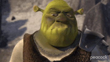 Movie gif. With a smudged dirty face, Shrek grins half-heartedly with an eyebrow raised.