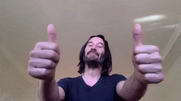 Celebrity gif. Keanu Reeves looks at us with a proud smile and two big thumbs up. 