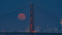 Blue Moon Rises Behind Golden Gate Bridge
