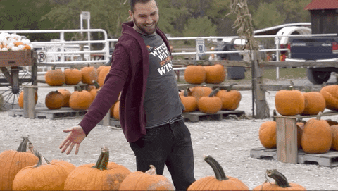 guy running through pumpkins