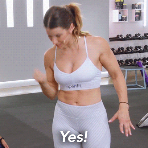 Video gif. Woman in athletic wear reaches her arm up in the air and then brings it down to do a strong fist bump. Text, “Yes!”