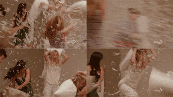 happy pillow fight GIF