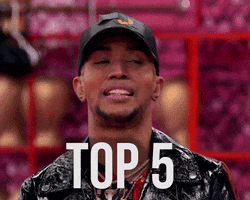 TV gif. Jason Carter of RuPaul's Drag Race in a leather jacket and black ball cap tips his head back and exclaims "Top 5!"