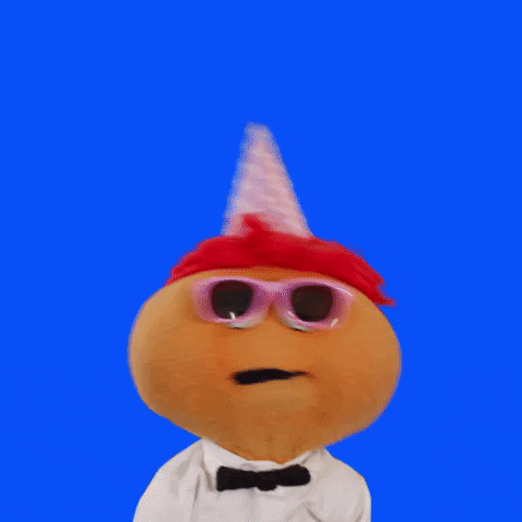 Video gif. Puppet named Gerbert with a red head of curly hair and a pink polka dot birthday hat, wears pink sunglasses and a white shirt with a black bow tie. It bobs its head around energetically as it says, "Happy 30th birthday! (you're for real now)'