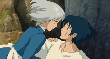 Anime gif. Sophie jumps on Howl of Howl’s Moving Castle, knocking him over as she embraces him.