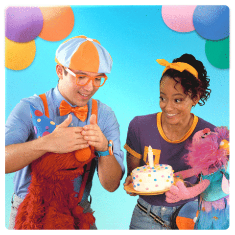 Sesame Street gif. Elmo and Abby Cadabby are wearing party hats and stand next to Meekah and Blippi. Meekah is holding a birthday cake and all of them jump up and down excitedly as they look at the cake and hype one another up.