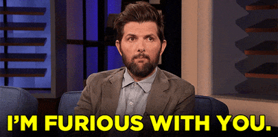 Celebrity gif. A bearded, extremely casual Adam Scott says to offscreen: Text, "I'm furious with you."