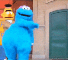 Sesame Street gif. Cookie Monster and Bert dance in celebration.