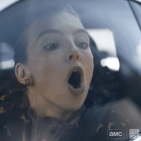TV gif. Jodie Comer as Villanelle on Killing Eve breathes onto the window of a car in motion, writing the word "help" with her finger in the fog.