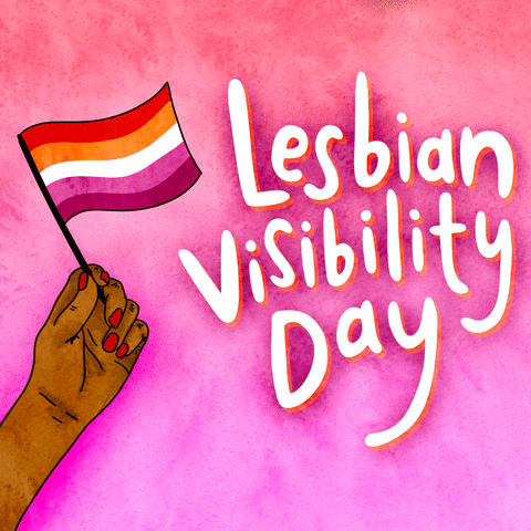 Digital art gif. Illustration of a hand with beautiful pink nails waving a little lesbian pride flag next to large white bubble letters that say, "Lesbian visibility day," all against an ombre pink background.