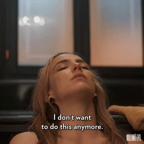 TV gif. Jodie Comer as Villanelle in Killing Eve rests her head back as she sighs with a tear-stained face and says, "I don't want to do this anymore."