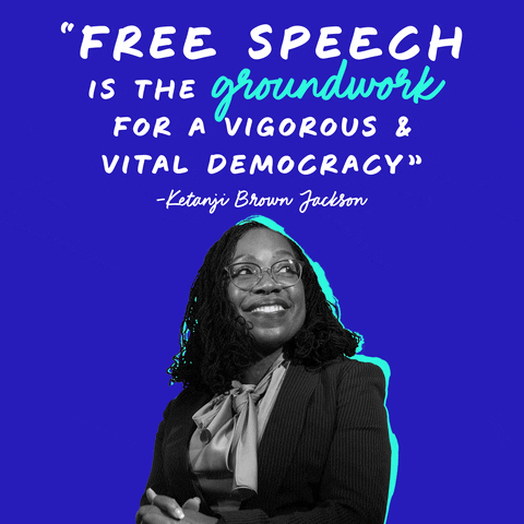 Political gif. Black and white portrait of Ketanji Brown Jackson looking up to our right as she smiles with her hands clasped. Quoted text reads, "Free speech is the groundwork for a vigorous and vital democracy."