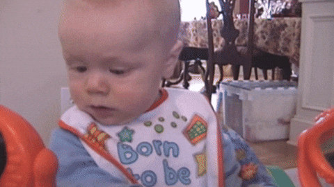  baby confused upset funny face pooping GIF