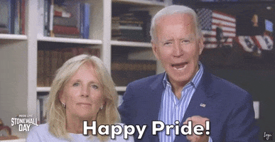 Political gif. President and First Lady Biden lean together in a room strung with American flags and speak earnestly, saying, "Happy Pride!"