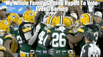 Video gif. Green Bay Packers football players celebrate together, jumping up and down and waving their hands in the air. Text, “My whole family getting hyped to vote Evers/Barnes.”