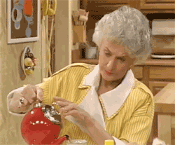 TV gif. Bea Arthur as Dorothy Zbornak on the Golden Girls pauses while pouring tea out of a teapot. She looks up with a blank and almost annoyed expression, trying to process what she has just heard.