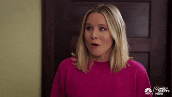 TV gif. Kristen Bell as Eleanor Shellstrop on the Good Place looks around with an excited expression on her face as she says, “Holy forking shirt balls.”