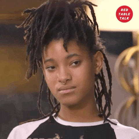 Celebrity gif. Willow Smith is on Red Table Talk and she nods her head slowly while saying, "Damn."