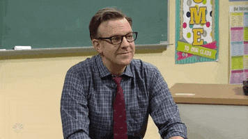 SNL gif. Jason Sudeikis as a school teacher raises his eyebrows bobs his head with a downturned mouth in a gesture of consideration or understanding.
