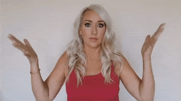 Video gif. Exasperated blond woman holds her hands in the air, nods, and says, “Yeah!”