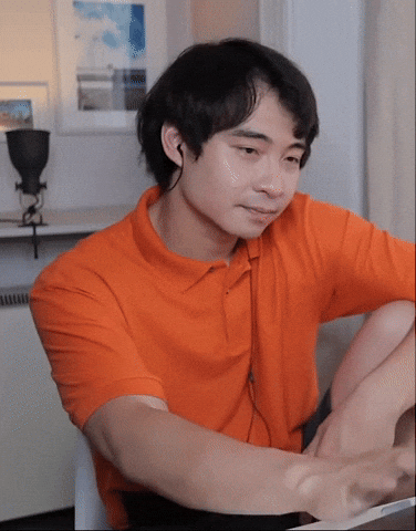 Video gif. Man sits with his arm resting on his knee as he looks at his computer screen. He smirks disappointedly and shakes his head.