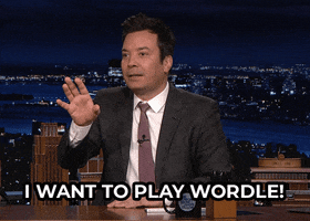 Tonight Show gif. Jimmy Fallon at his desk looking out at audience, saying, "I want to play wordle."