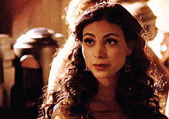 Video gif. Morena Baccarin speaks with a slightly disapproving look.