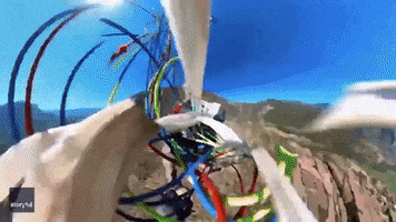 Parachute Paragliding GIF by Storyful
