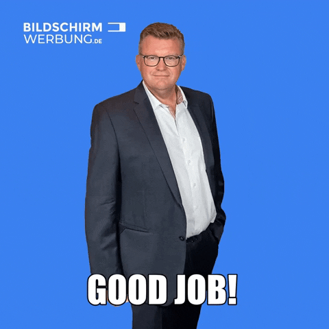 Ad gif. A manager from Bildschirm Werbung has a hand in one pocket and gives us a hearty thumbs up with the other hand. His lips tighten with pride. Text, "Good Job!"