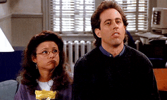 Seinfeld gif. Julia Louis-Dreyfus as Elaine and Jerry simultaneously shrug their shoulders.
