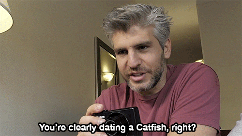 Man holding a camera and saying you're clearly dating a Catfish, right?