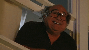 TV gif. Danny DeVito as Frank in It's Always Sunny in Philadelphia leans out of a window, smiling and saying "I think our work here is done."