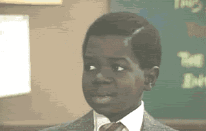 Video gif. A young boy's eyes move slowly and thoughtfully from left to right. In realization, he looks back to the left and tilts his head in confusion.